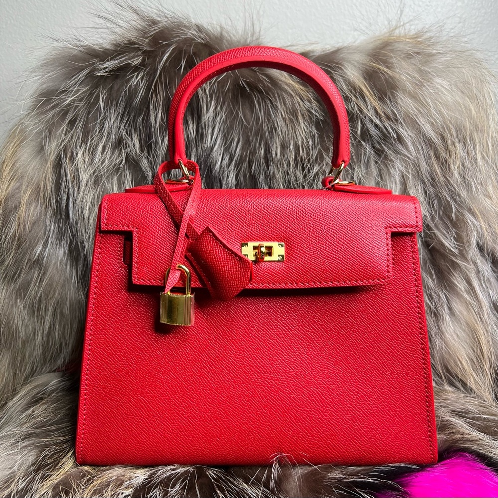 Red Leather 25cm classic silhouette handbag with shoulder strap, lock, and key